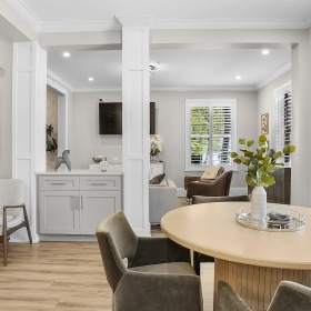 Take advantage of all River Oaks has to offer a large living room with a table and chairs