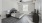 a living room with a couch and a fan