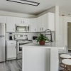 a kitchen with white cabinets
